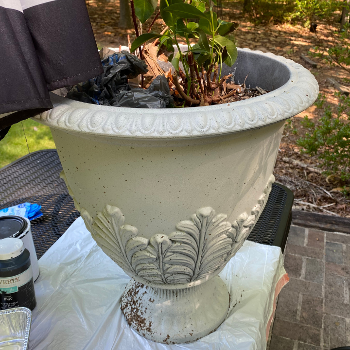 white spray painted urn