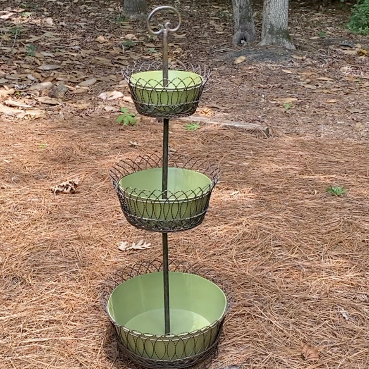 three tiered metal basket with green pots