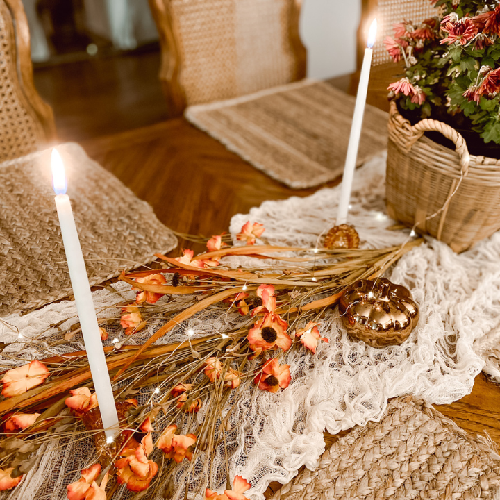 pumpkins, and candle holders on a fall tablescape