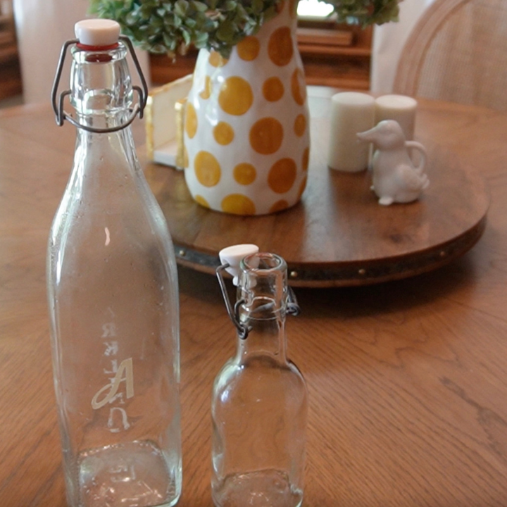 Glass Bottles with lids on a table
